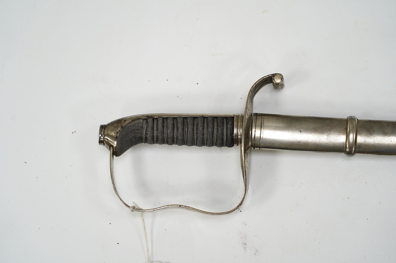 An 1861 Austrian sabre with intaglio initialled hilt and Solingen blade, in its steel scabbard, plated overall, blade 76cm. Condition - good